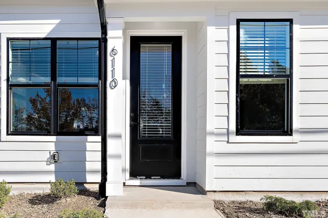a large kitchen with granite countertop a sink stainless steel appliances and cabinets