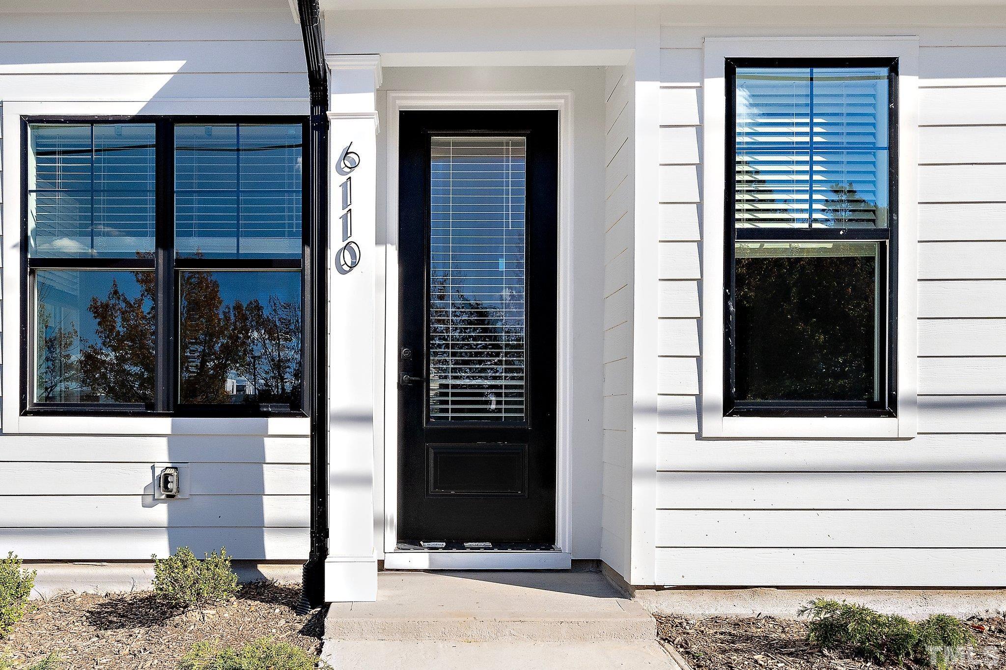 6104 Fox Raleigh, NC 27616 - Photo 33 of 54 a view of a door of a house with a door and a window