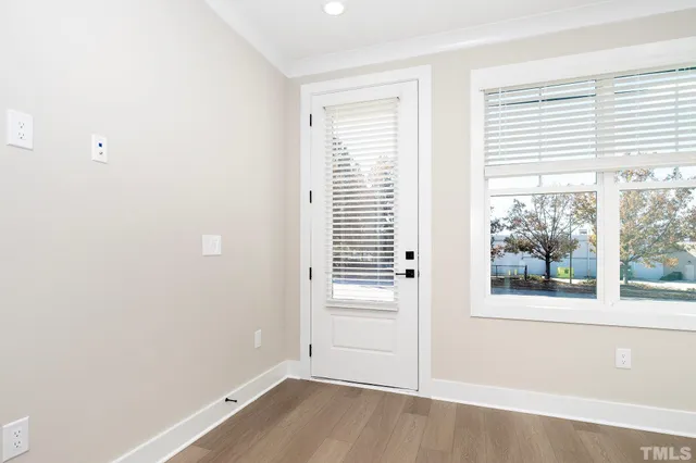 a kitchen with stainless steel appliances granite countertop a sink and a refrigerator