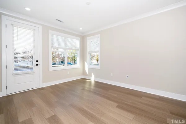 a kitchen with stainless steel appliances granite countertop a sink a stove and a refrigerator