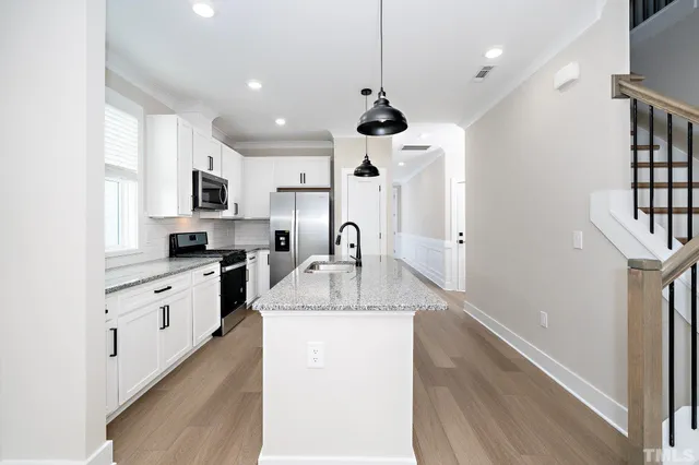 a bathroom with a sink a mirror and toilet