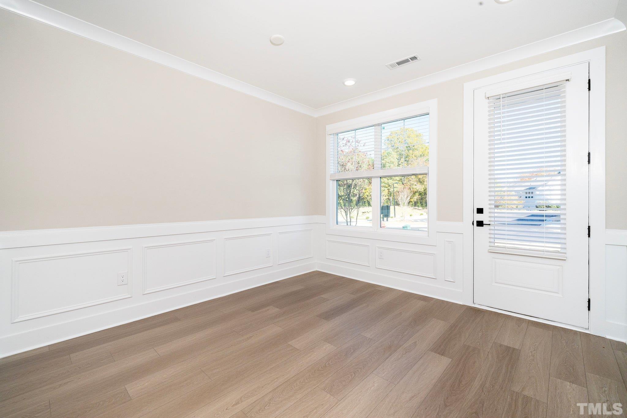 6104 Fox Raleigh, NC 27616 - Photo 43 of 54 wooden floor in an empty room with a window
