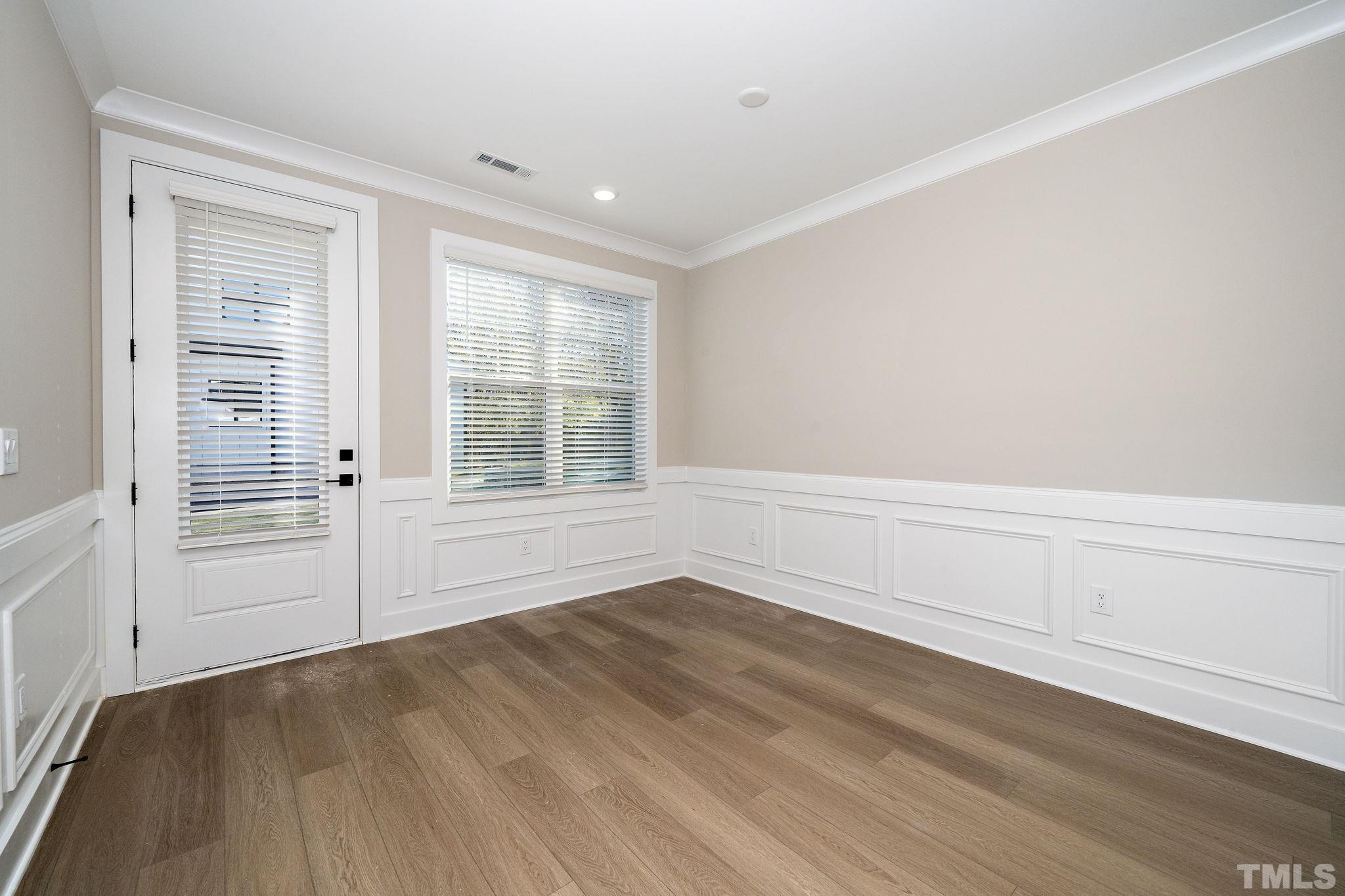 6104 Fox Raleigh, NC 27616 - Photo 7 of 54 wooden floor in an empty room with a window