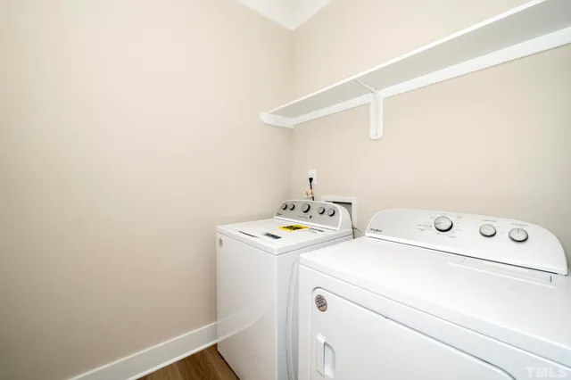 a kitchen with stainless steel appliances granite countertop a stove top oven microwave and cabinets