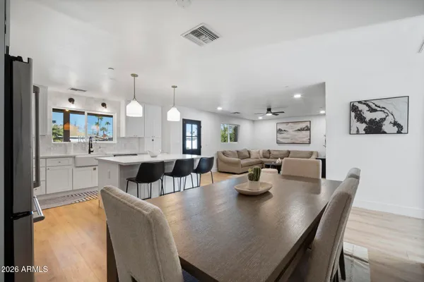 a living room with furniture a rug and a flat screen tv