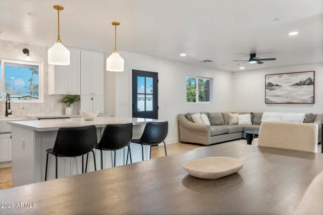 a kitchen with a sink stove and refrigerator