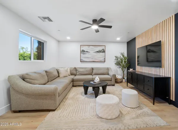 a terrace with outdoor seating and city view