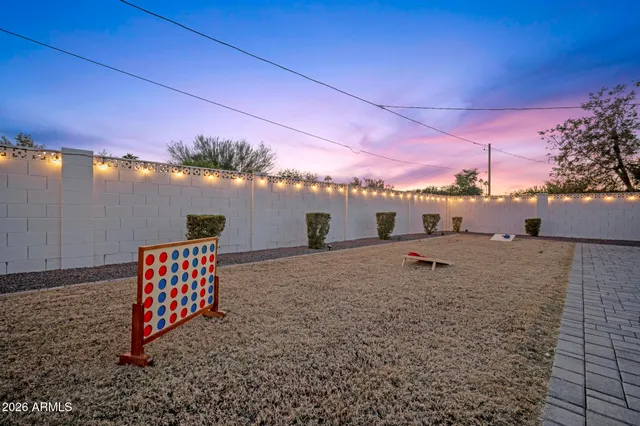 a view of a swimming pool with a yard