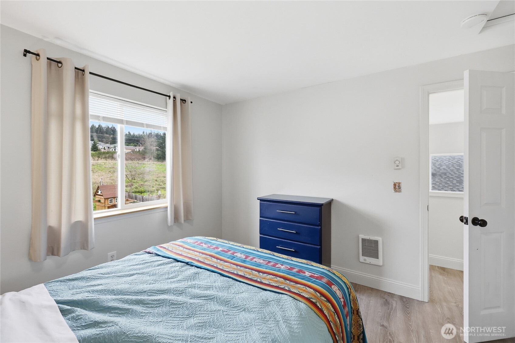 110 Alpine Loop Sequim, WA 98382 - Photo 21 of 36 a bedroom with a bed and a window