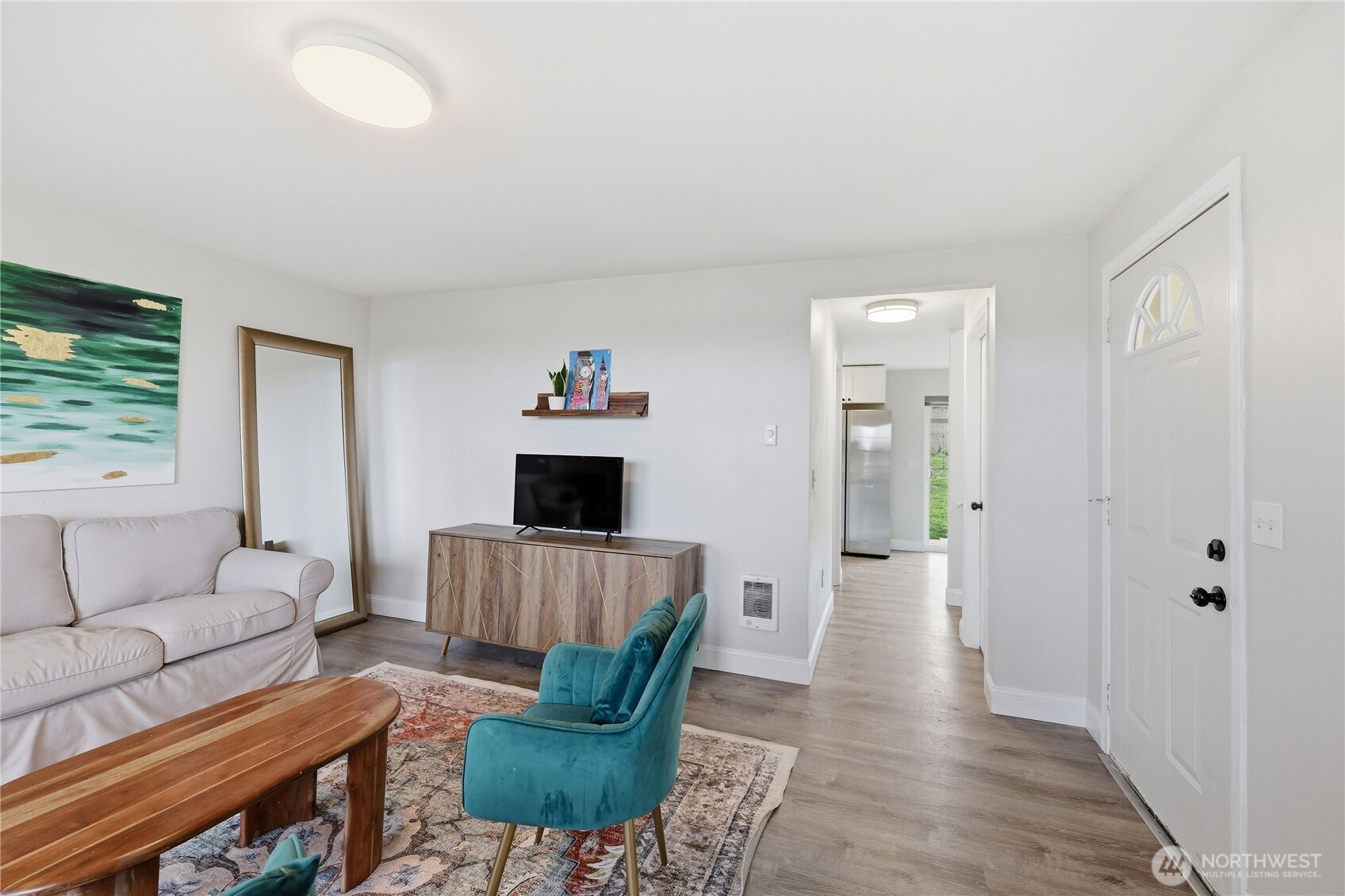 110 Alpine Loop Sequim, WA 98382 - Photo 8 of 36 a living room with furniture and a wooden floor