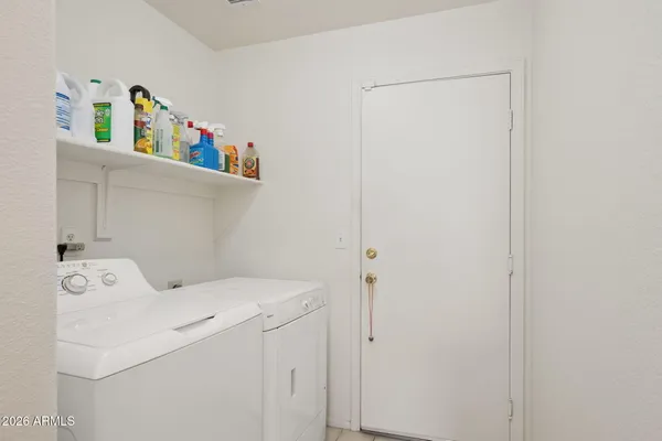 a bedroom with a bed wooden floor and ceiling fan