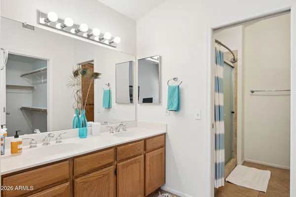 a bathroom with a glass shower door