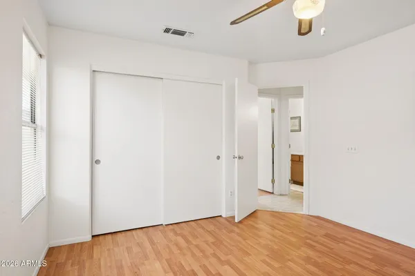 a view of a workspace with furniture and wooden floor