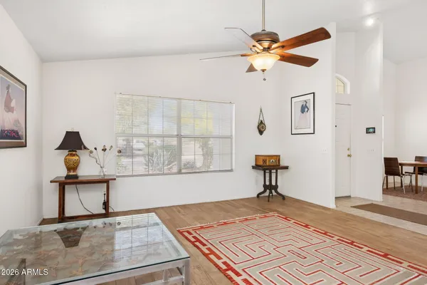 a living room with furniture and a rug