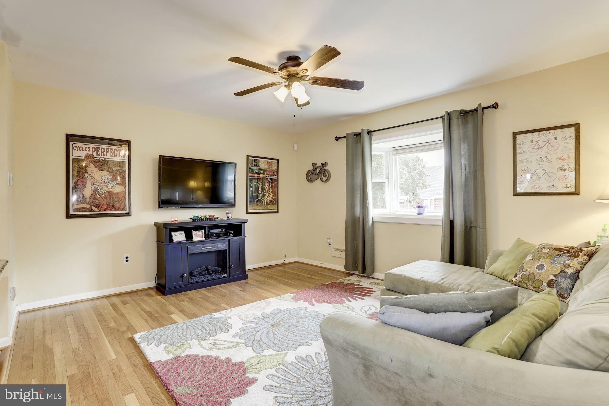 6134 Wheatland Road Baltimore, MD 21228 - Photo 11 of 30 a bedroom with a bed and a flat screen tv