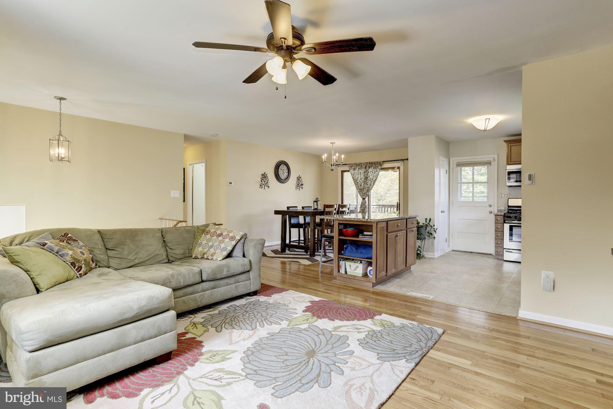 6134 Wheatland Road Baltimore, MD 21228 - Photo 12 of 30 a living room with furniture and kitchen view