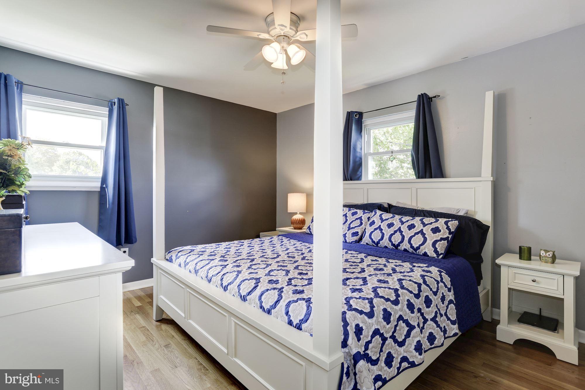 6134 Wheatland Road Baltimore, MD 21228 - Photo 14 of 30 a bedroom with a bed and a table in it