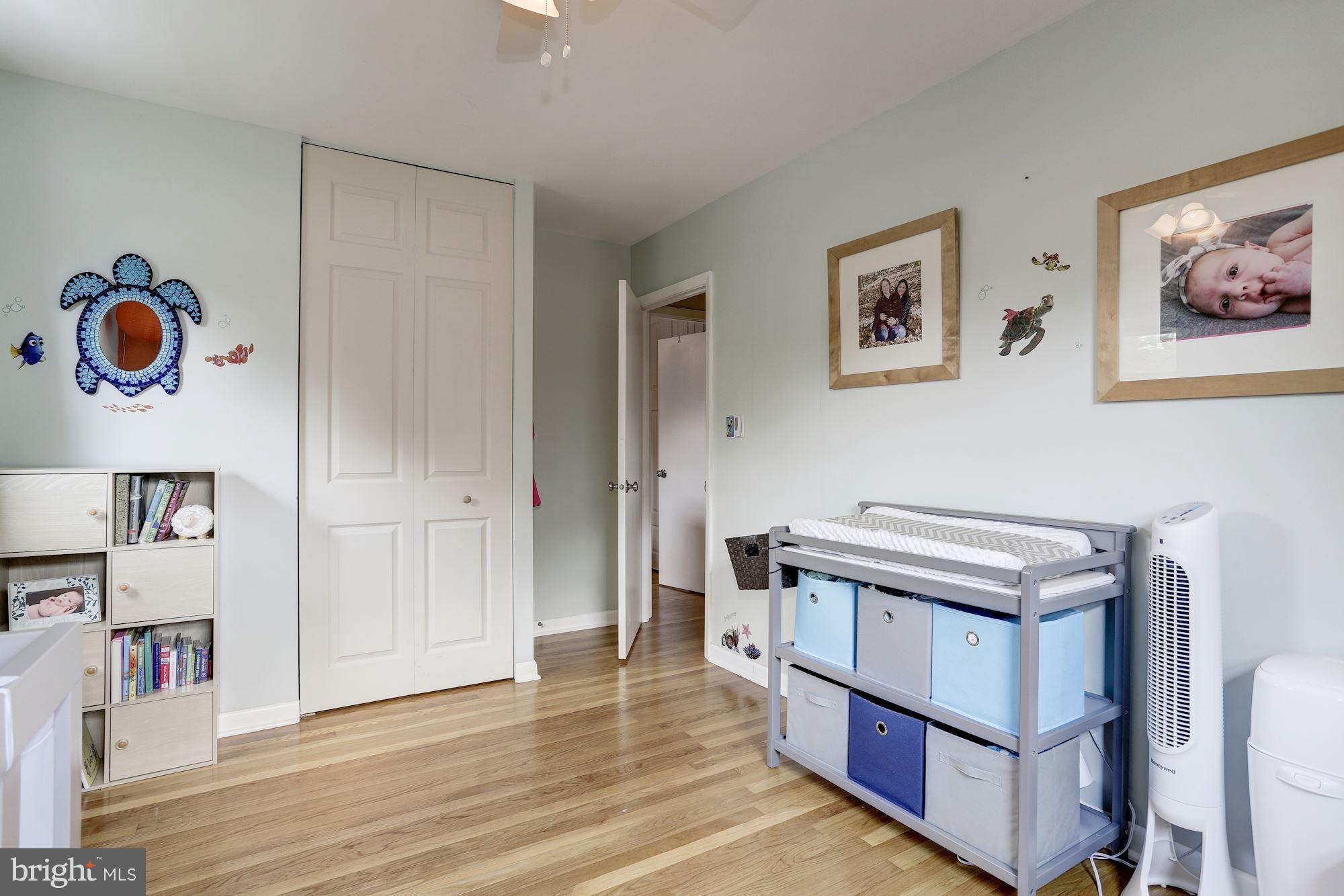 6134 Wheatland Road Baltimore, MD 21228 - Photo 17 of 30 a hallway with a view of kitchen with wooden floor