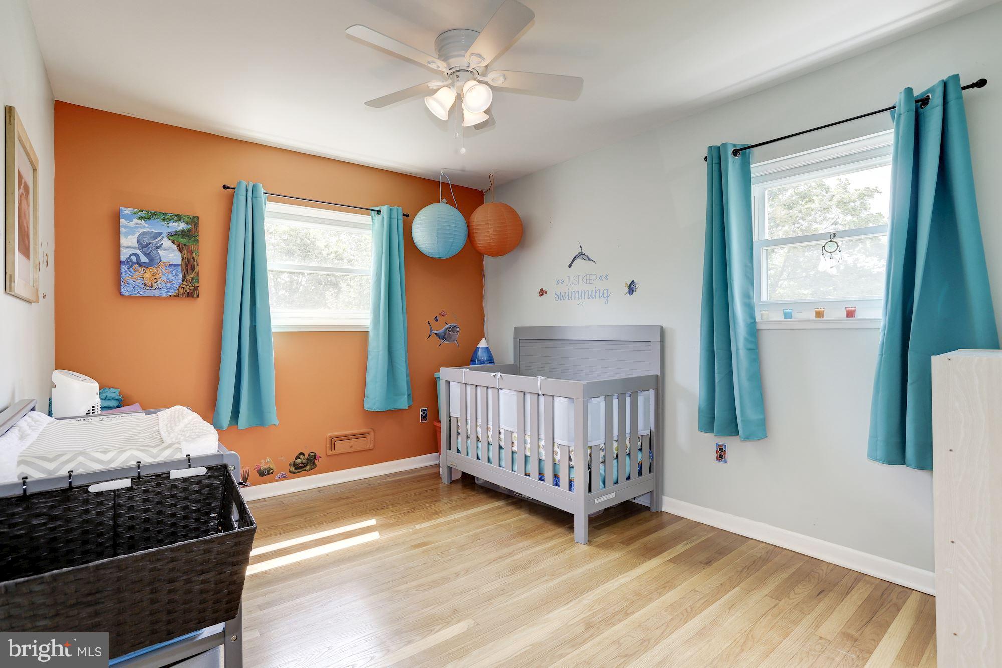 6134 Wheatland Road Baltimore, MD 21228 - Photo 18 of 30 a bedroom with a bed and a window