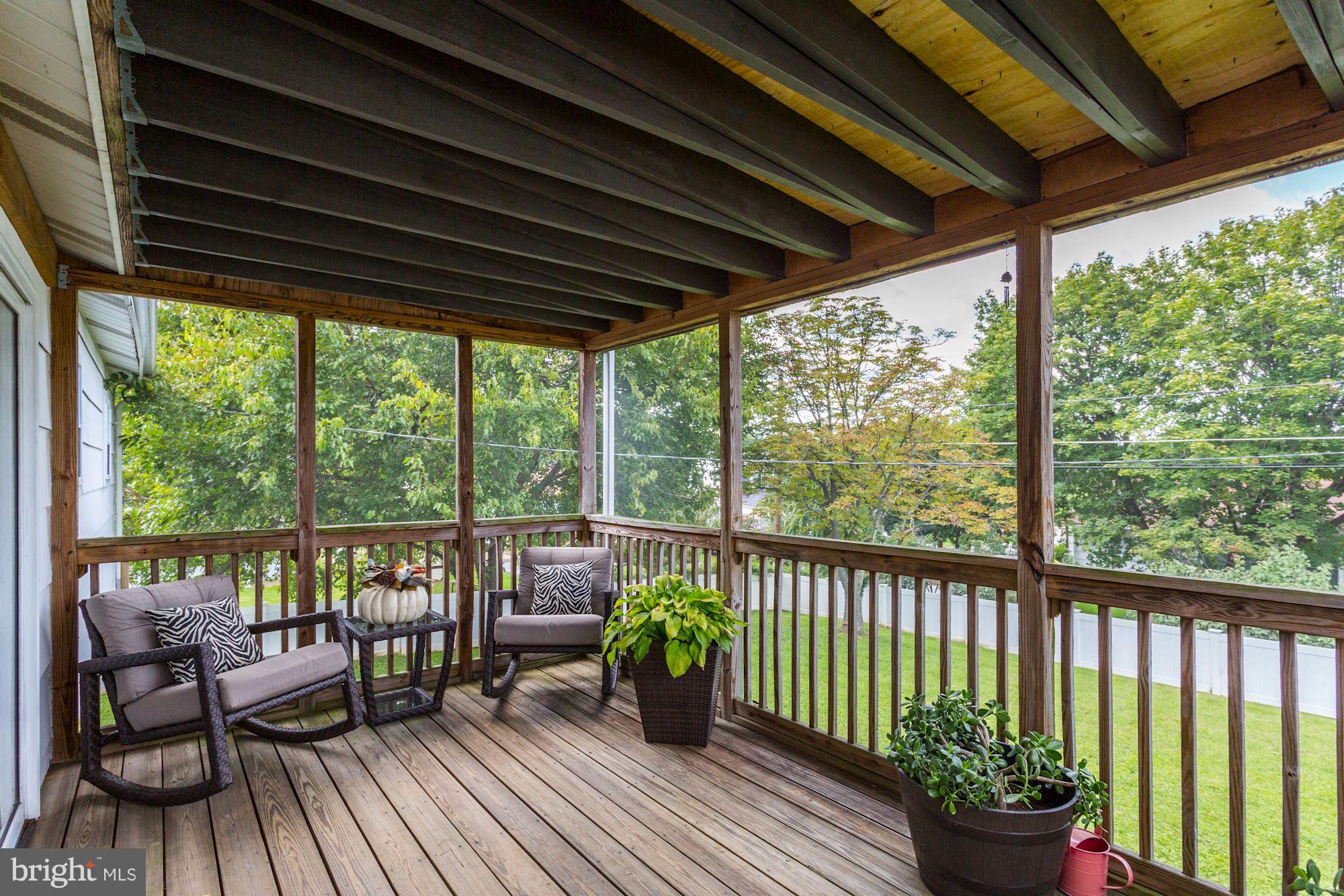 6134 Wheatland Road Baltimore, MD 21228 - Photo 24 of 30 a view of a chair and tables in the balcony