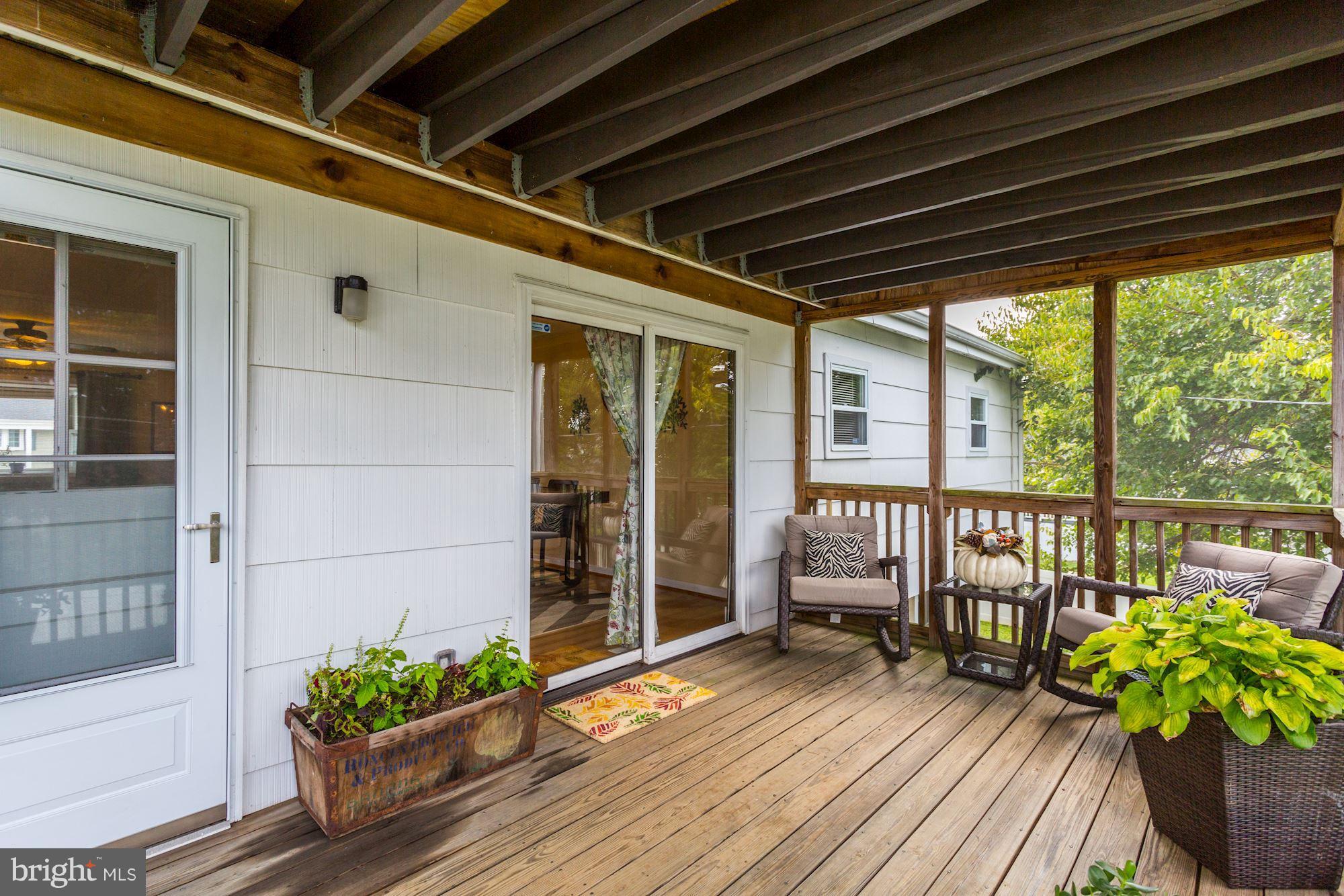 6134 Wheatland Road Baltimore, MD 21228 - Photo 25 of 30 a porch with wooden floor