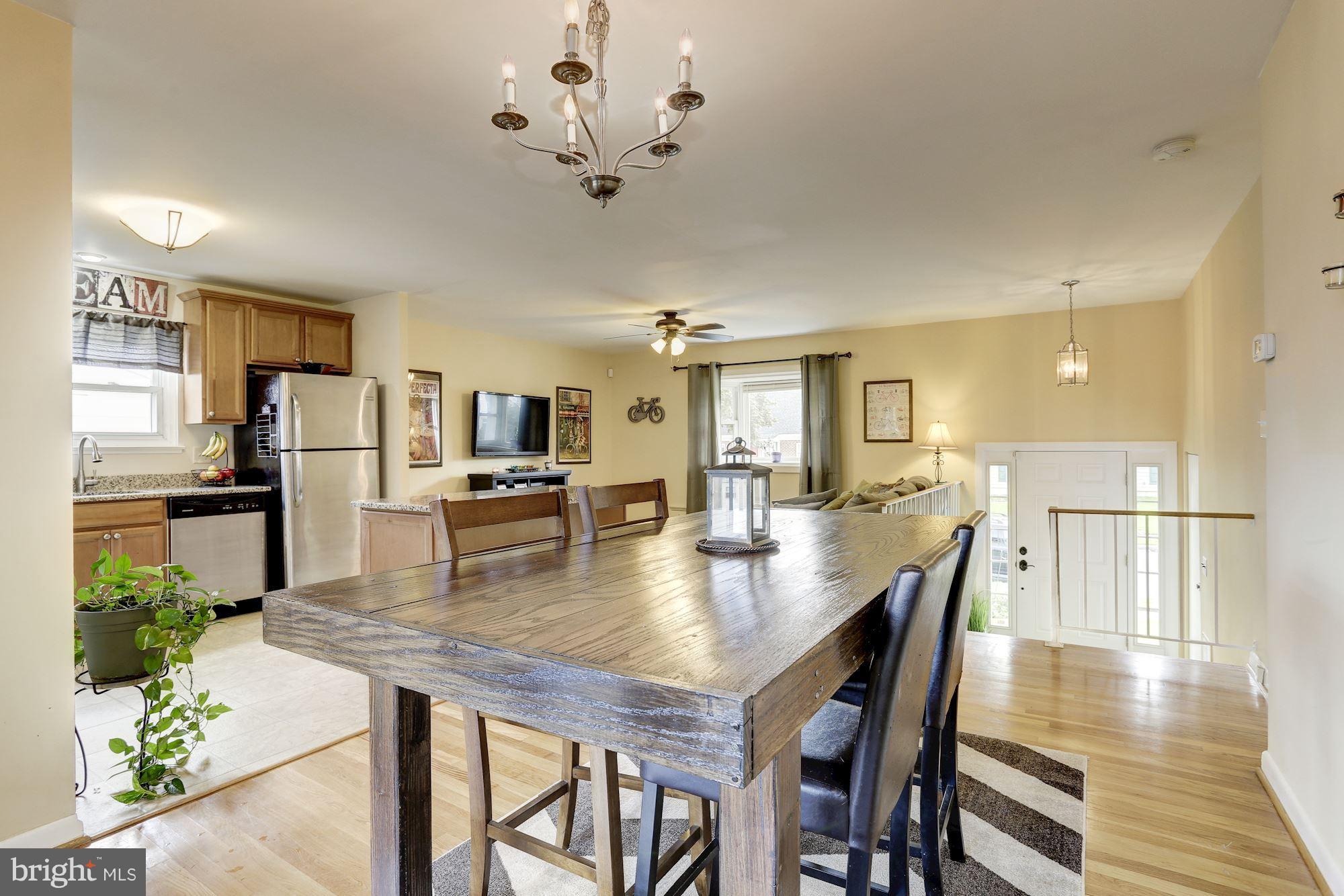 6134 Wheatland Road Baltimore, MD 21228 - Photo 9 of 30 a view of a dining room with furniture and wooden floor