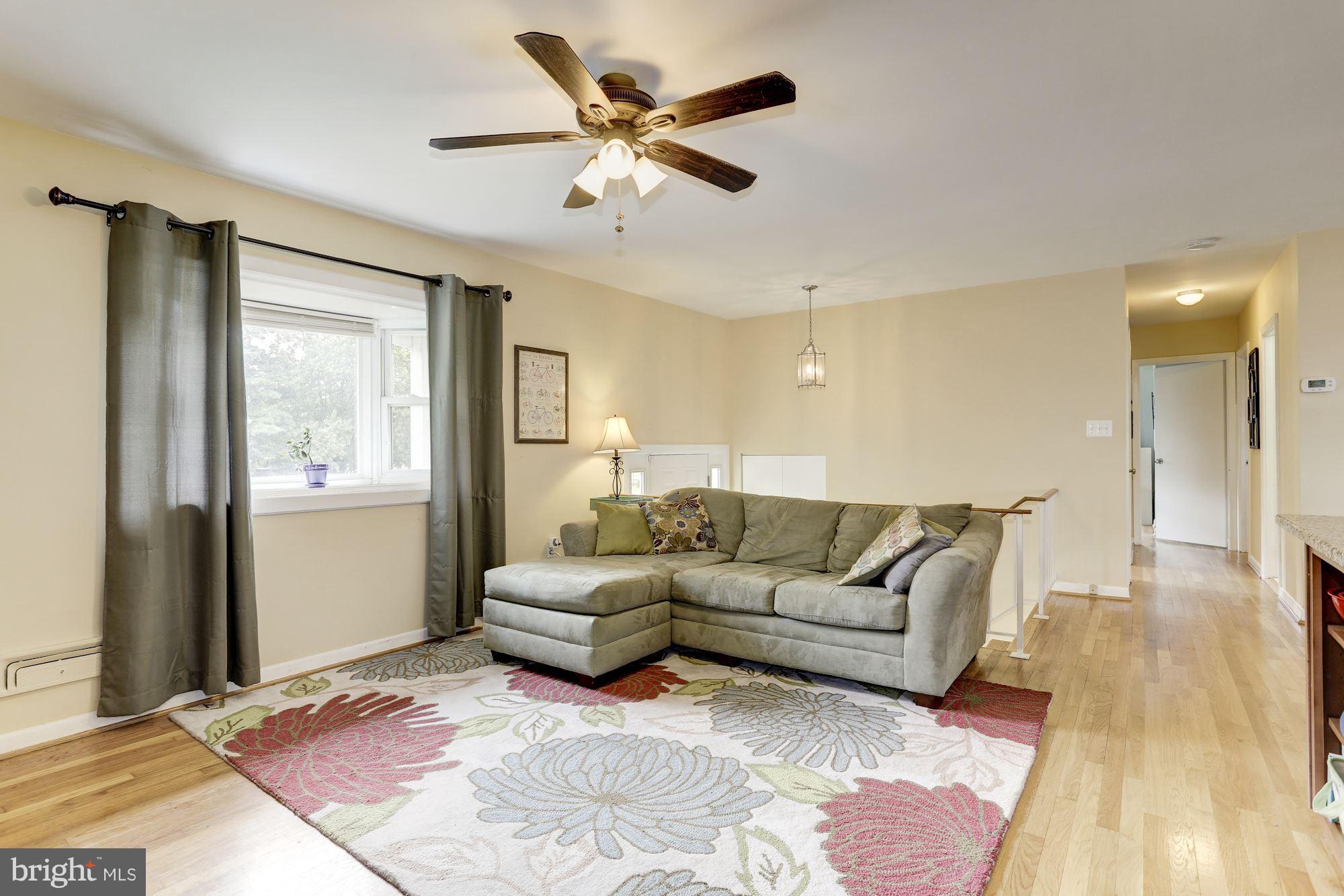 6134 Wheatland Road Baltimore, MD 21228 - Photo 10 of 30 a living room with furniture and a large window