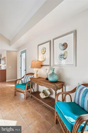 a view of kitchen with stainless steel appliances granite countertop a dining table and chairs