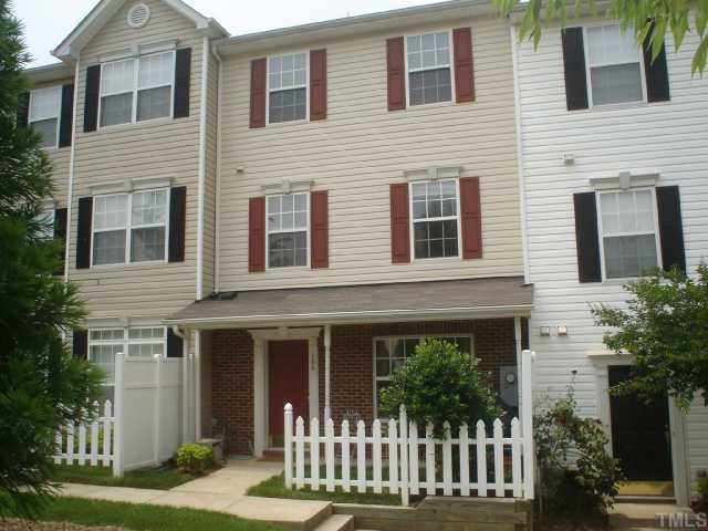 2611 Ivory Run Way, Unit 106 Raleigh, NC 27603 - Photo 1 of 9 a front view of a house with a garden