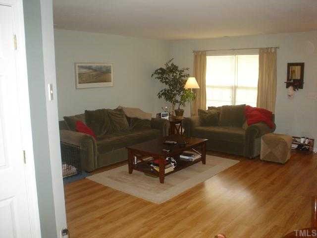 2611 Ivory Run Way, Unit 106 Raleigh, NC 27603 - Photo 3 of 9 a living room with furniture rug and window