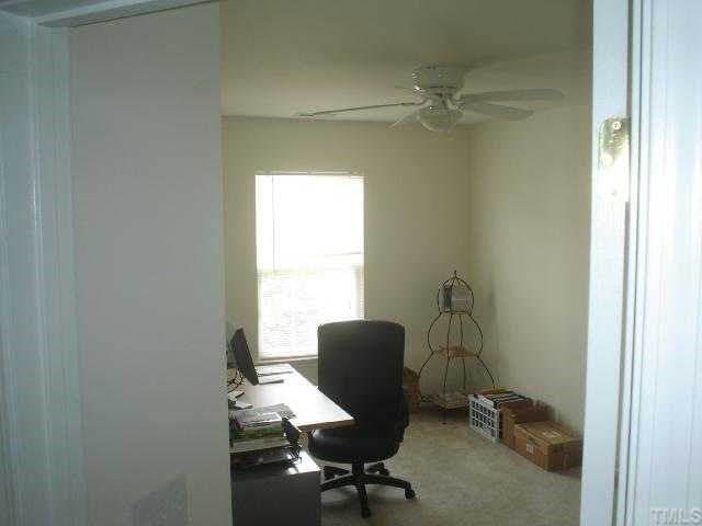 2611 Ivory Run Way, Unit 106 Raleigh, NC 27603 - Photo 5 of 9 a view of a workspace with furniture and a window