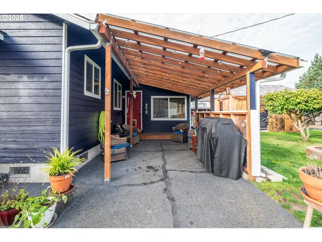 a view of a porch with potted plants