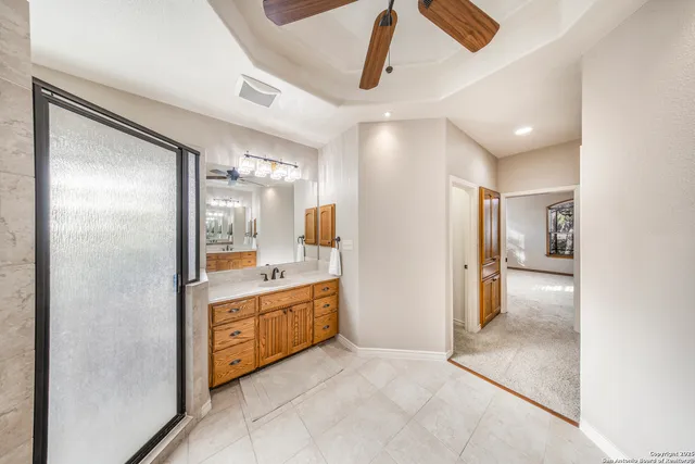 a bathroom with a mirror and a shower