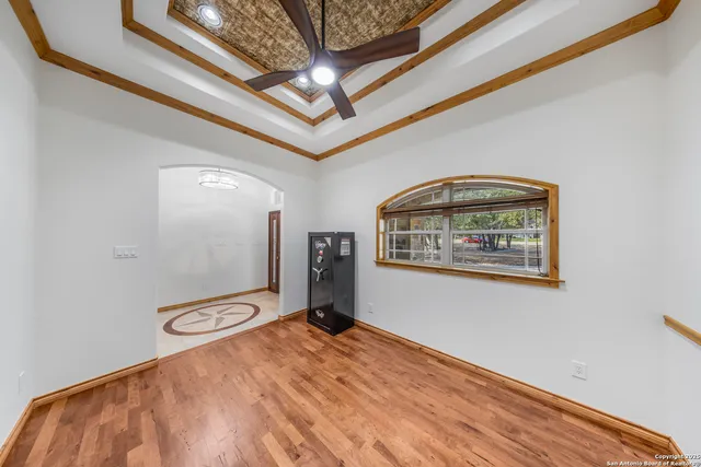 a view of a hallway with a wooden floor