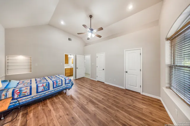 a bedroom with bed and window