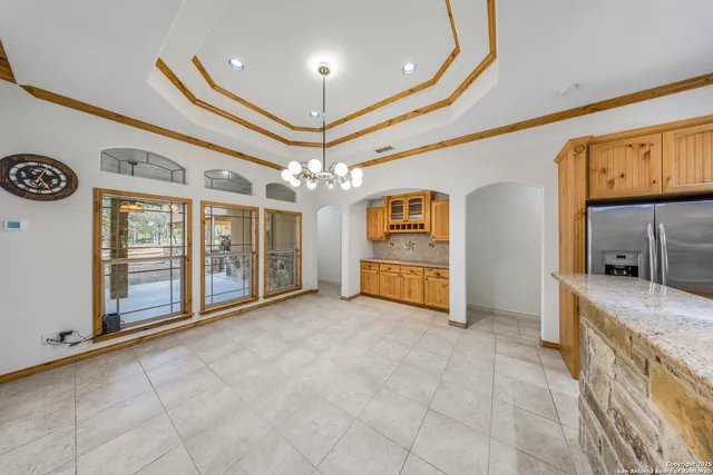 a view of an empty room and a window