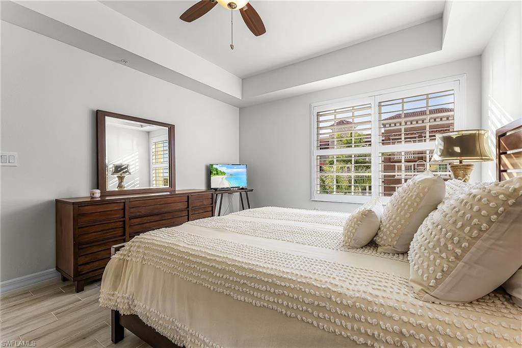 401 Bayfront Place, Unit 3405 Naples, FL 34102 - Photo 17 of 31 a bedroom with a bed and a large window