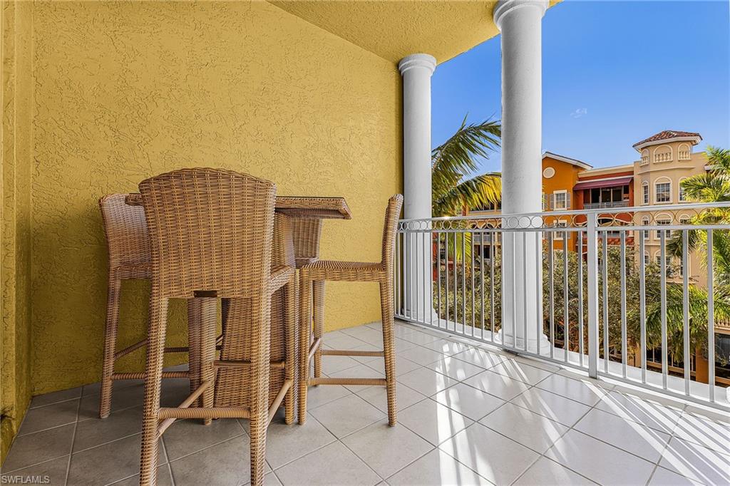 401 Bayfront Place, Unit 3405 Naples, FL 34102 - Photo 22 of 31 a view of balcony with wooden floor and seating space