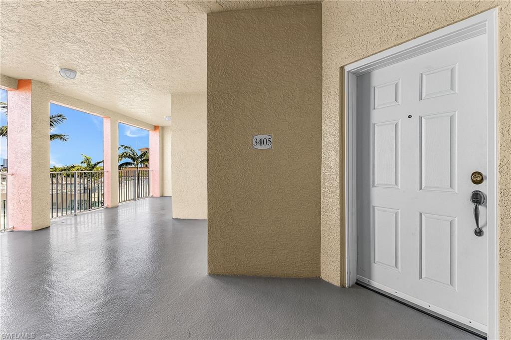 401 Bayfront Place, Unit 3405 Naples, FL 34102 - Photo 3 of 31 a view of a hallway with wooden floor windows and a living room