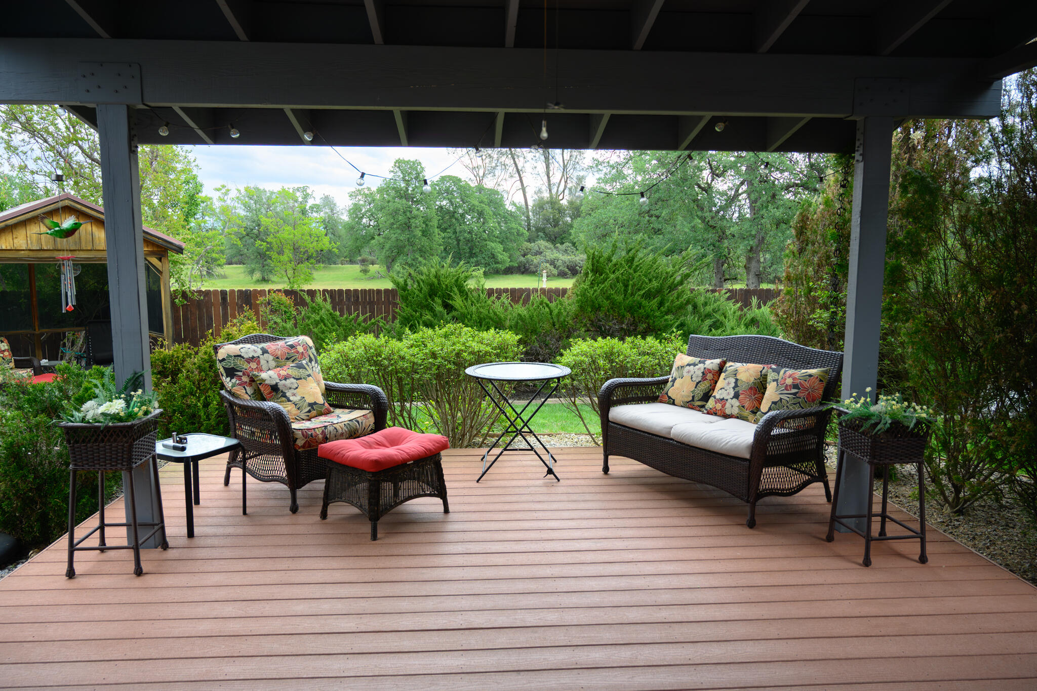 2071 Hope Lane Redding, CA 96003 - Photo 12 of 45 a view of a patio with couches table and chairs and potted plants