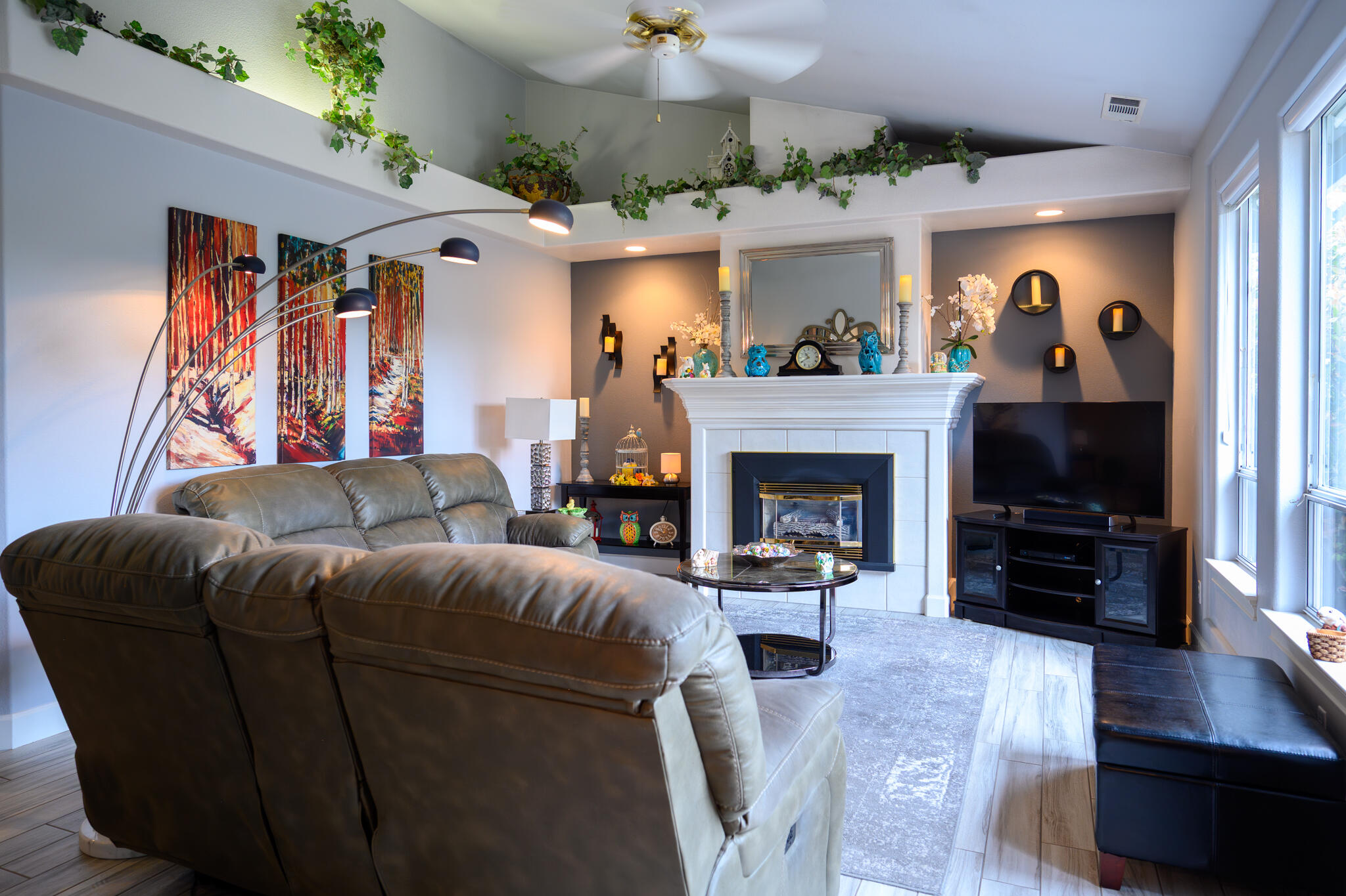 2071 Hope Lane Redding, CA 96003 - Photo 13 of 45 a living room with furniture a flat screen tv and a fireplace