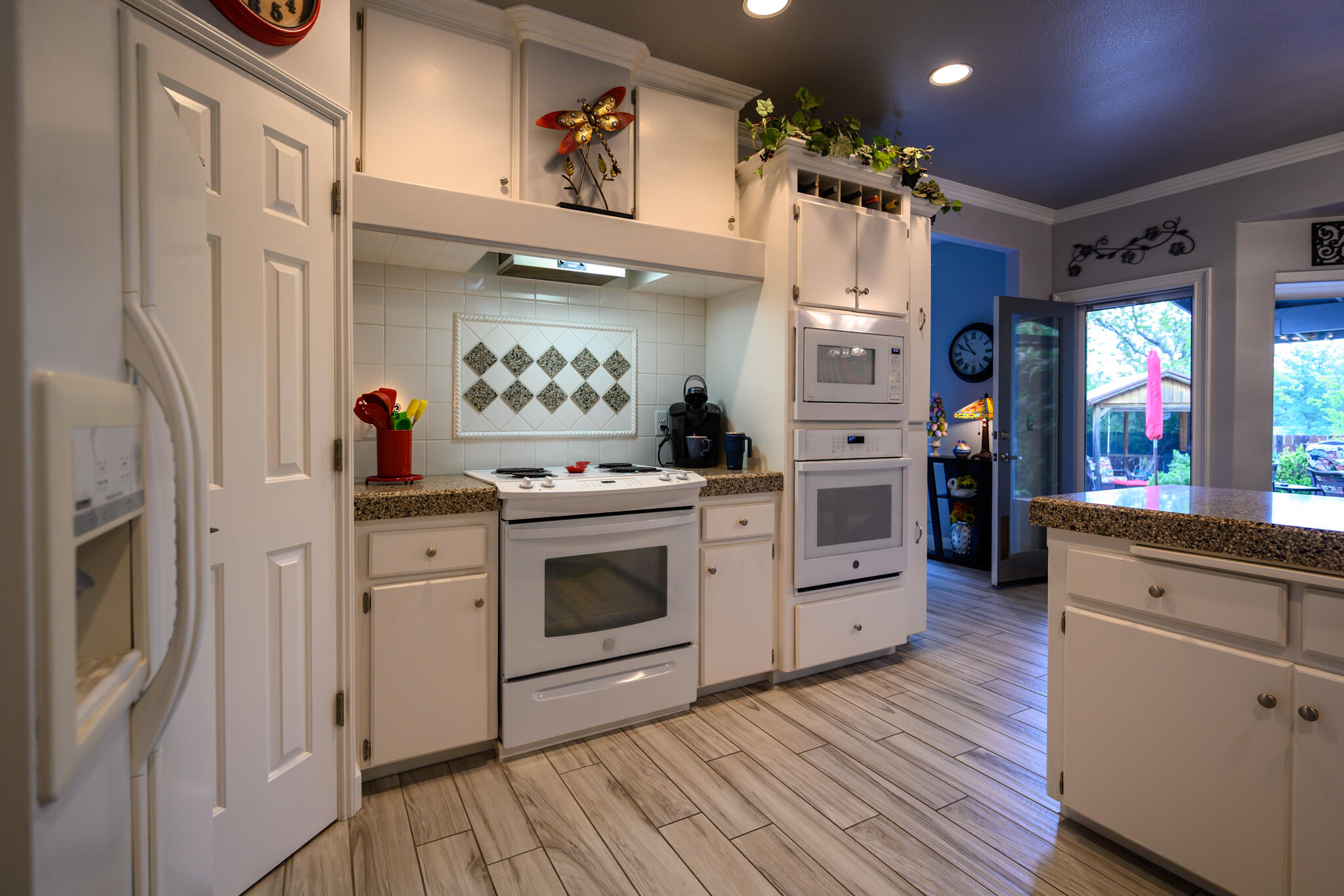 2071 Hope Lane Redding, CA 96003 - Photo 20 of 45 a kitchen with white cabinets and white appliances