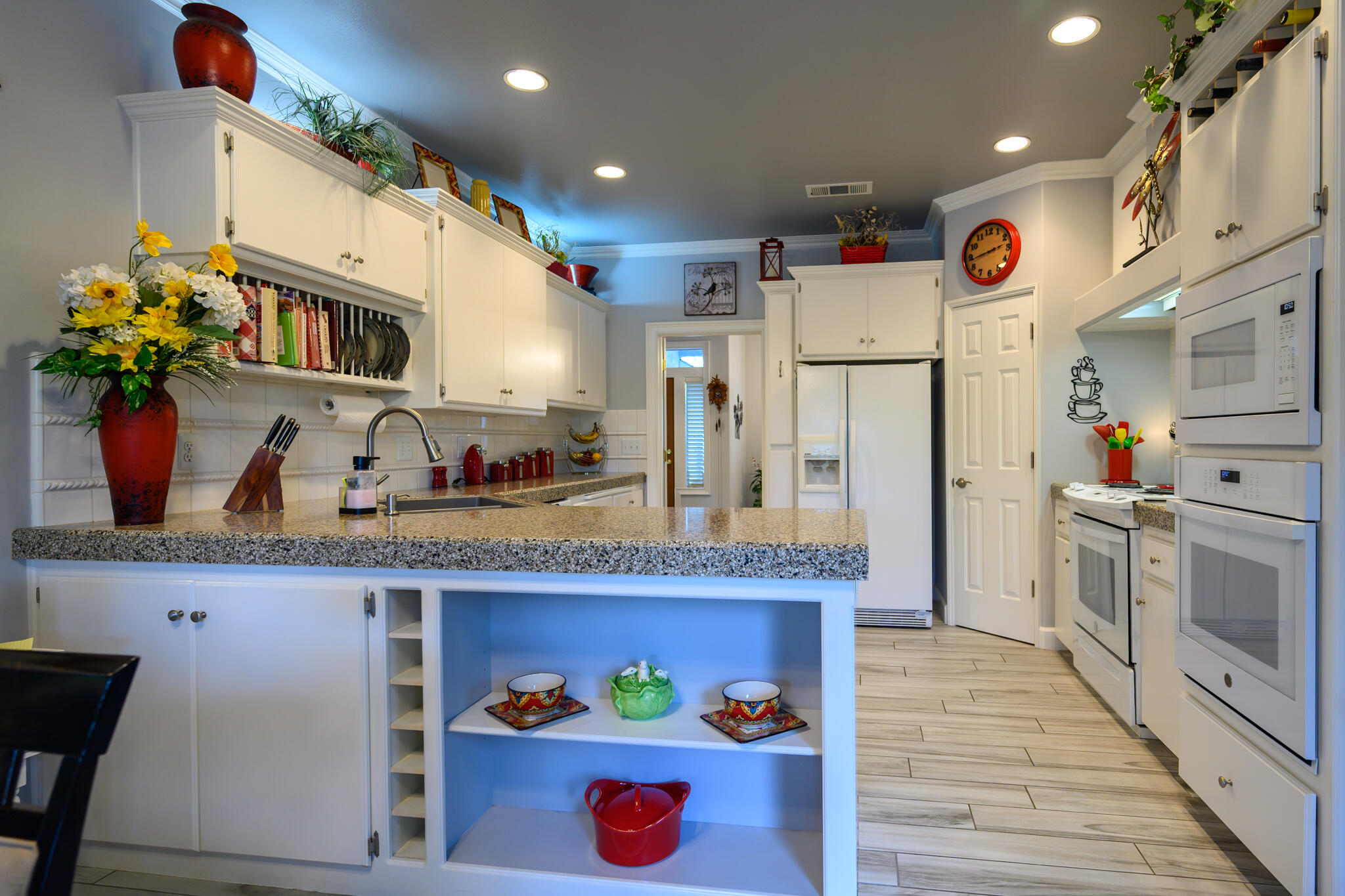 2071 Hope Lane Redding, CA 96003 - Photo 21 of 45 a kitchen with stainless steel appliances granite countertop a refrigerator and a stove top oven