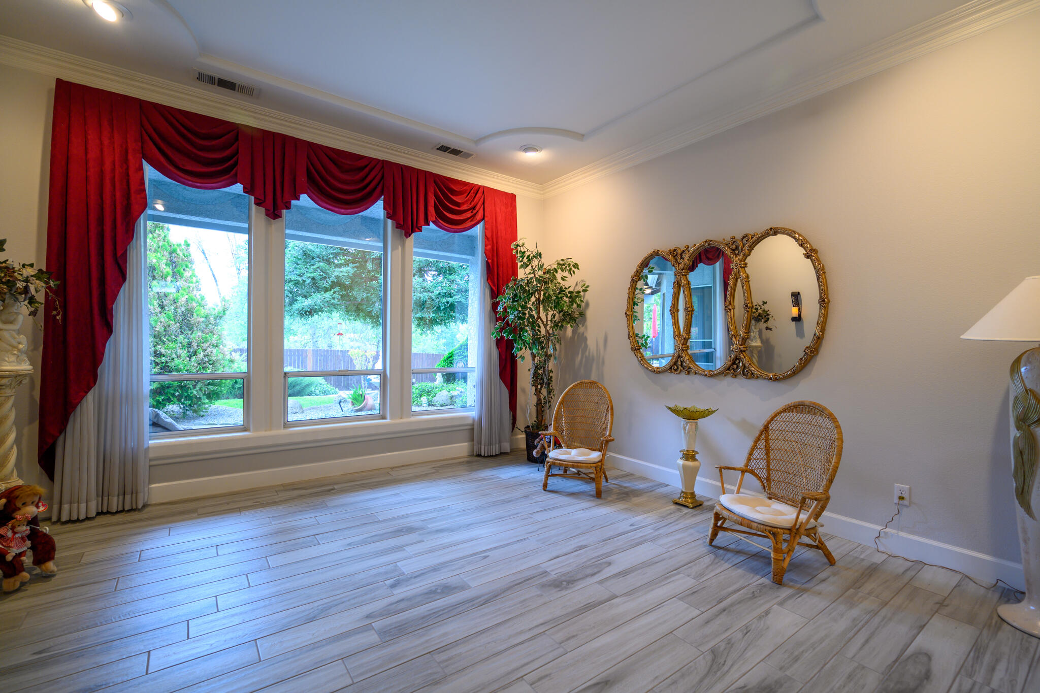 2071 Hope Lane Redding, CA 96003 - Photo 28 of 45 a living room with furniture a mirror and a large window