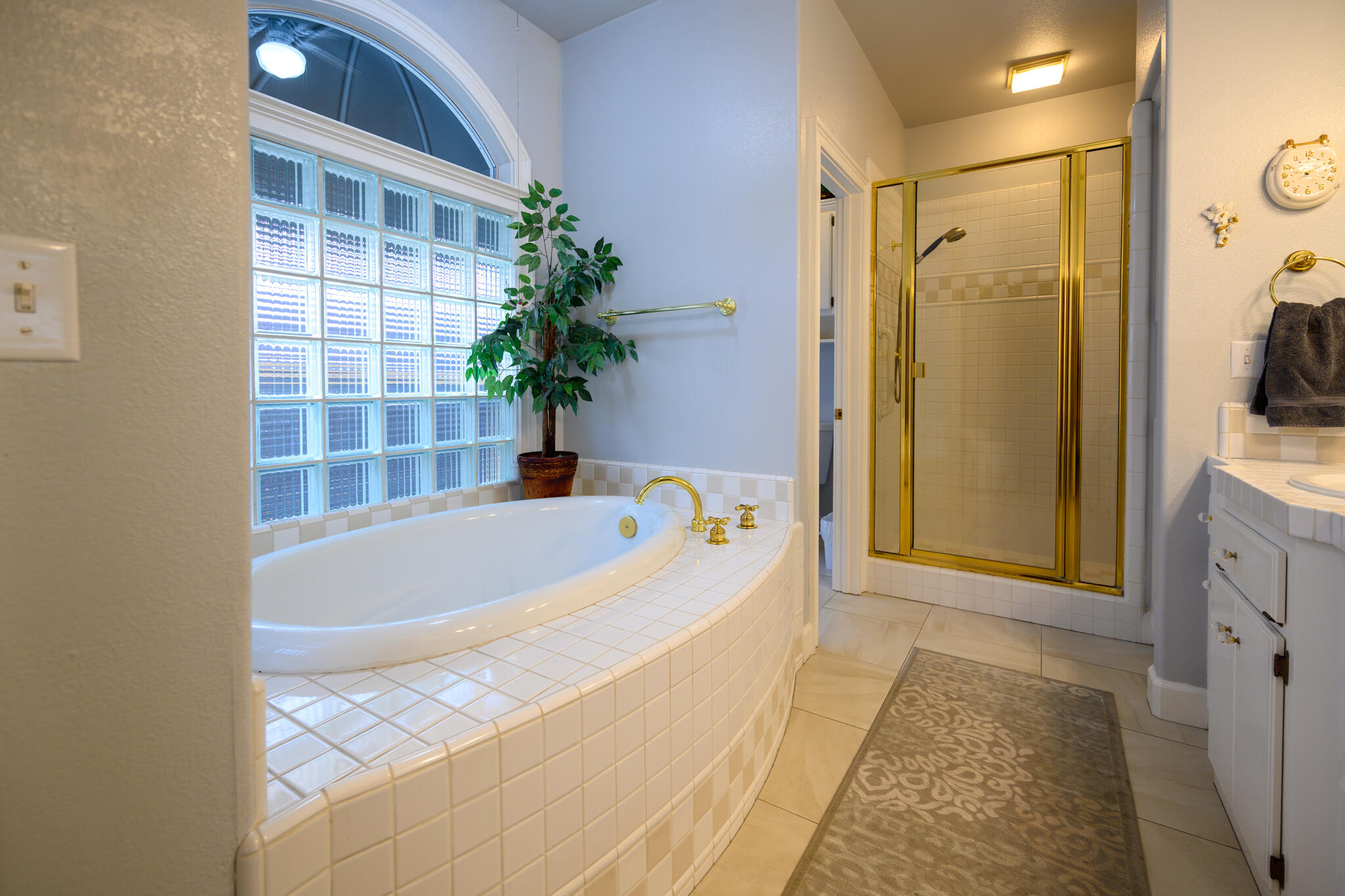 2071 Hope Lane Redding, CA 96003 - Photo 34 of 45 a bathroom with a bathtub and shower