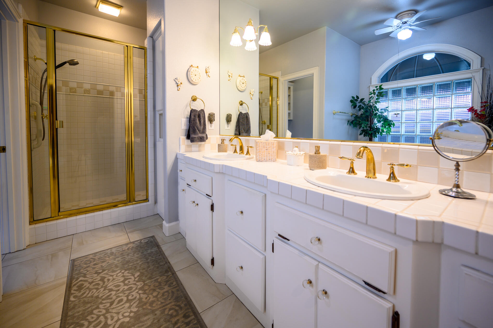 2071 Hope Lane Redding, CA 96003 - Photo 35 of 45 a bathroom with a double vanity sink mirror and shower