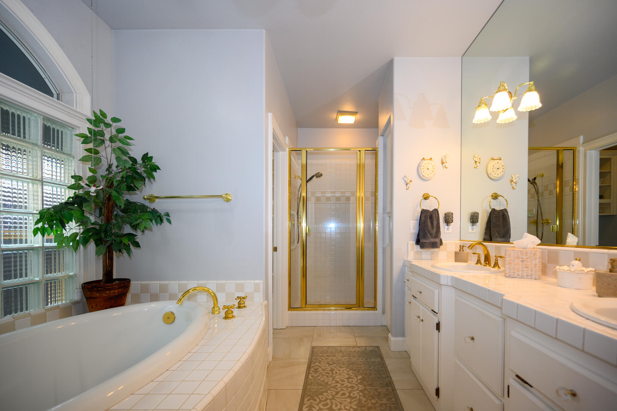 2071 Hope Lane Redding, CA 96003 - Photo 36 of 45 a spacious bathroom with a double vanity sink and a mirror
