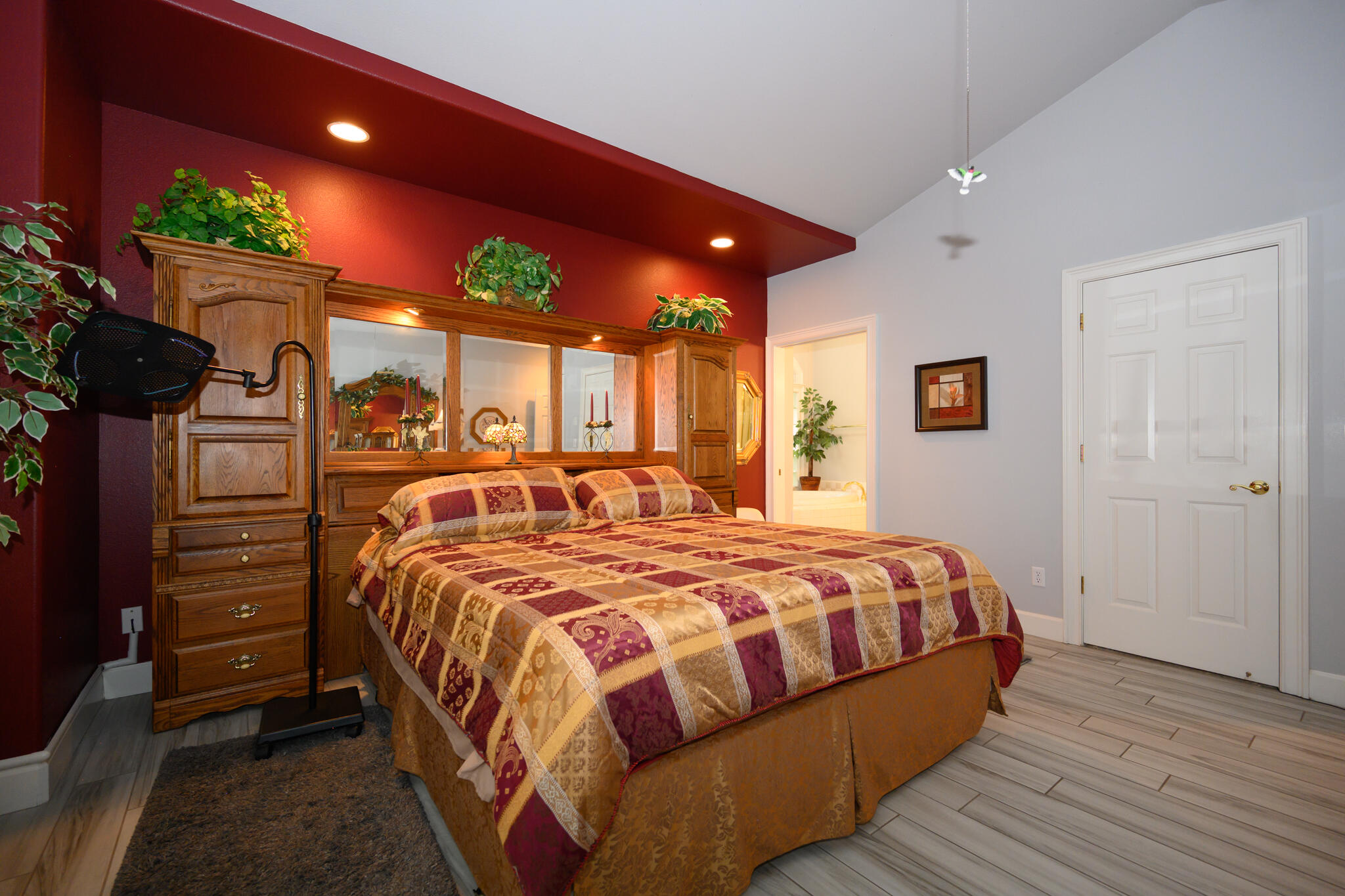 2071 Hope Lane Redding, CA 96003 - Photo 39 of 45 a bedroom with a bed window and potted plant