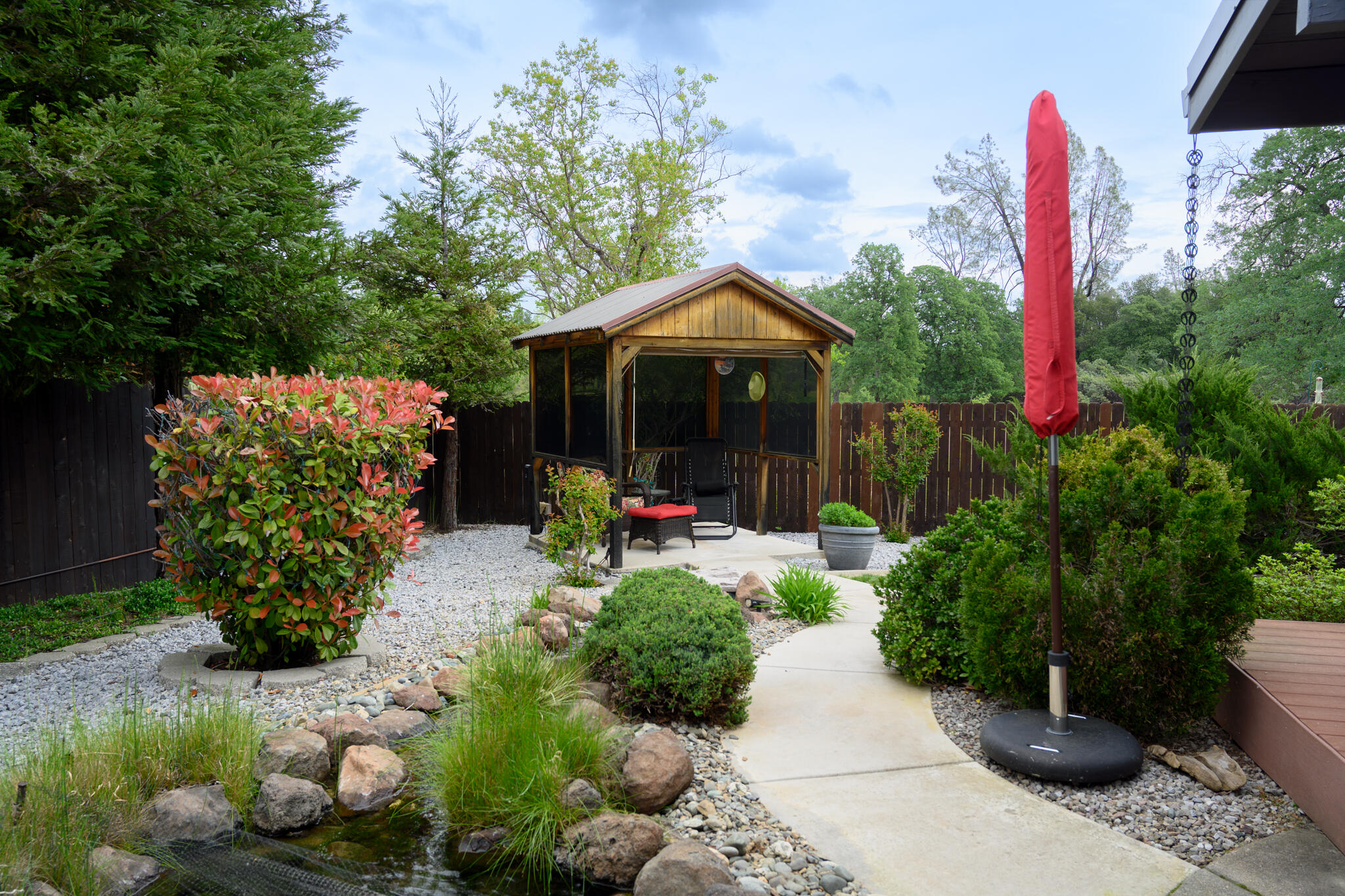 2071 Hope Lane Redding, CA 96003 - Photo 5 of 45 a view of a garden with plants and large trees