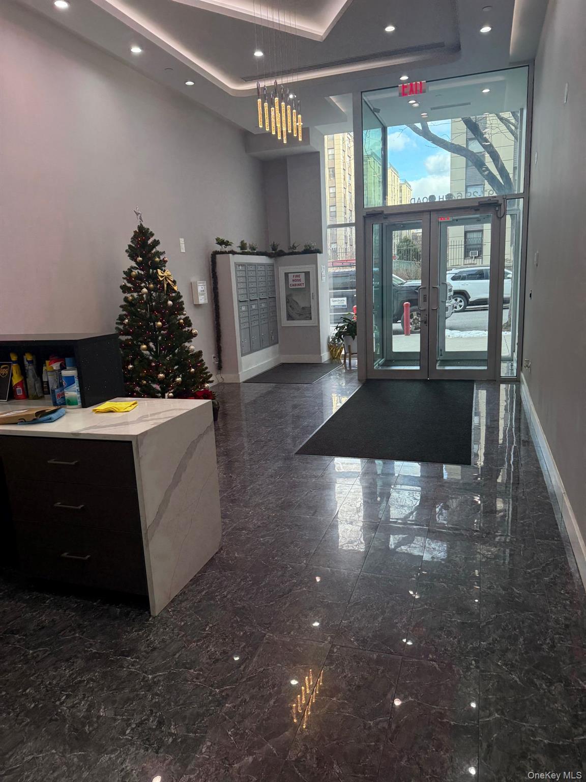 97-29 64th Road Queens, NY 11374 - Photo 11 of 12 a kitchen with a sink and large cabinets